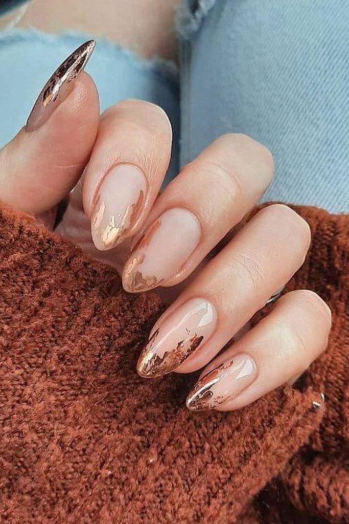 Iridescent flicks drift over matte nails