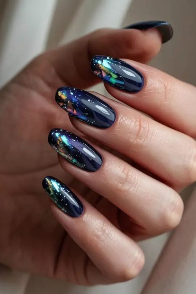 Navy black gradient nails with silver moons.
