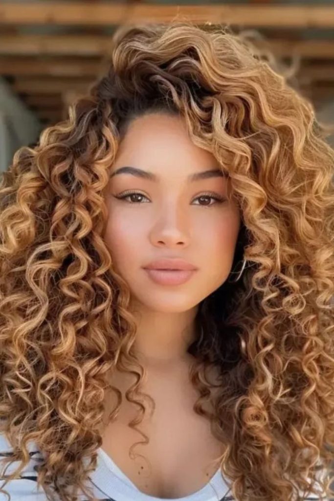 Compact stacked curls with bold silhouette.