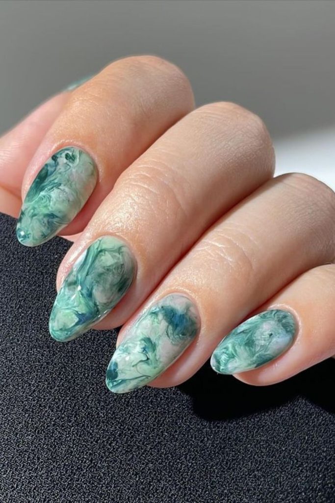 Sage marbled nails with cream accents