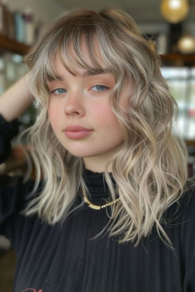 Tiny chopped fringe hovering above eyelids