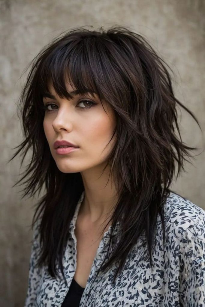 Deep black textured wolf cut.