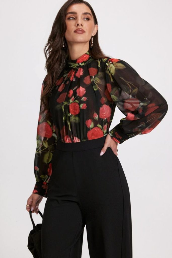 Sheer floral top with black trousers