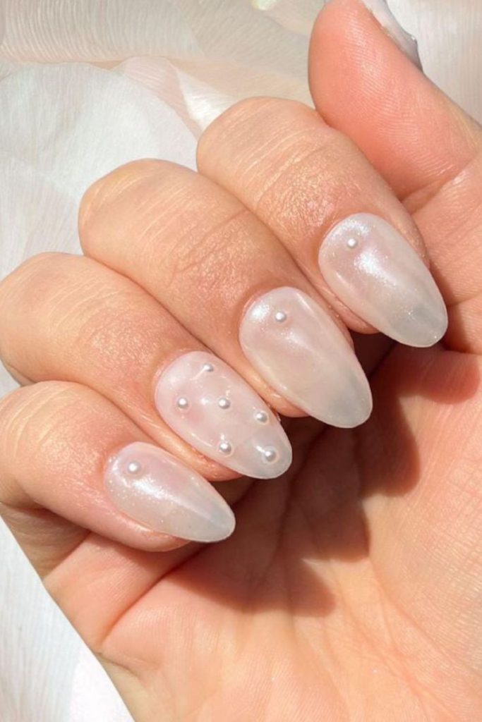 Pearl-infused milky nails subtle shimmer.