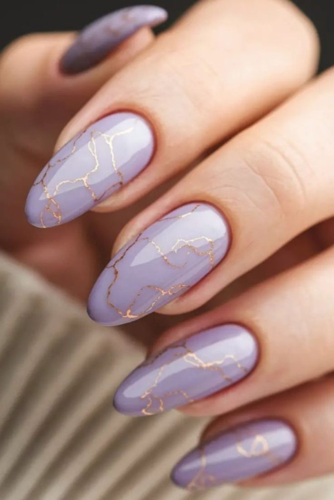 Violet nails with silver petal veins.