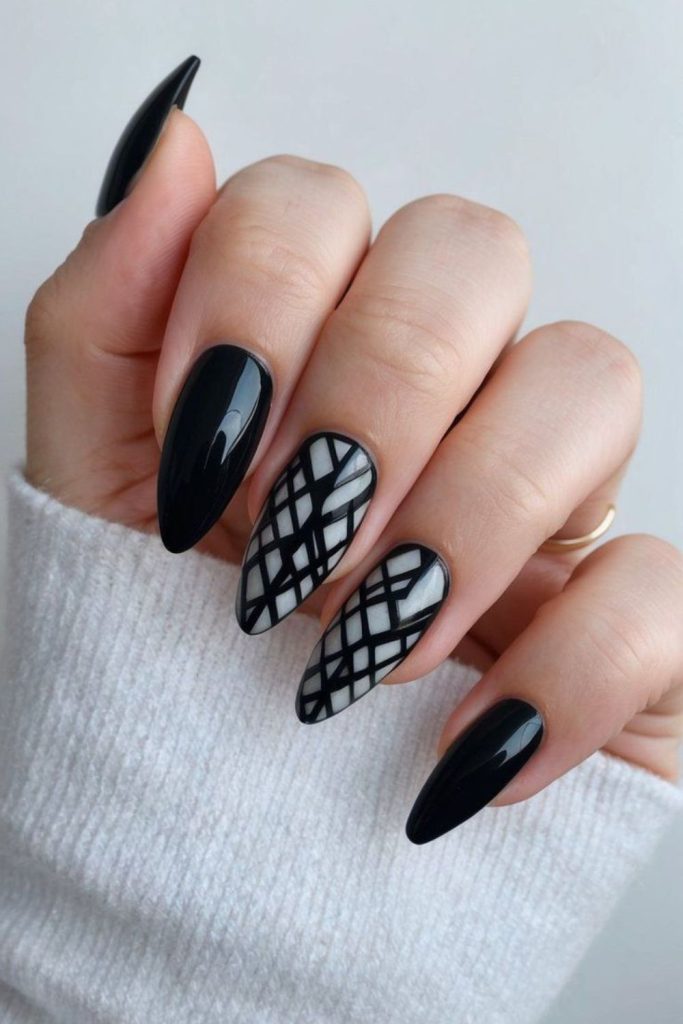 Jagged shards scattered across black nails