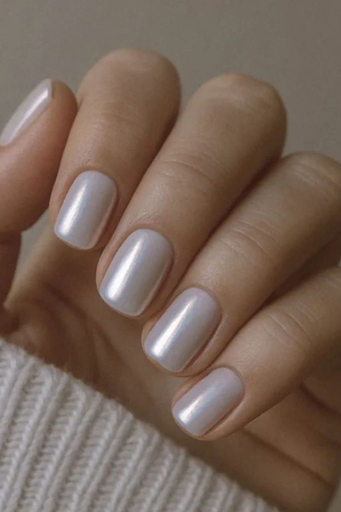 Pearly oyster-toned milky nails shine.