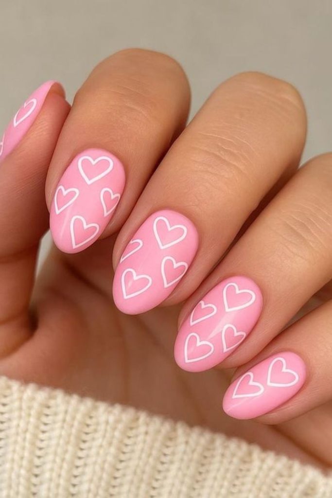 Pink static heart pattern nails.