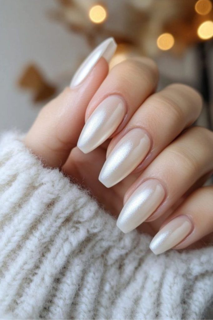 Soft milky nails with subtle luxury shine.
