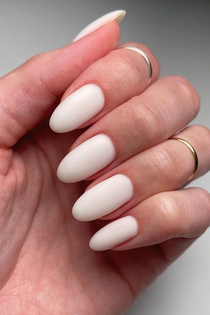 Powdery milk nails with matte finish.