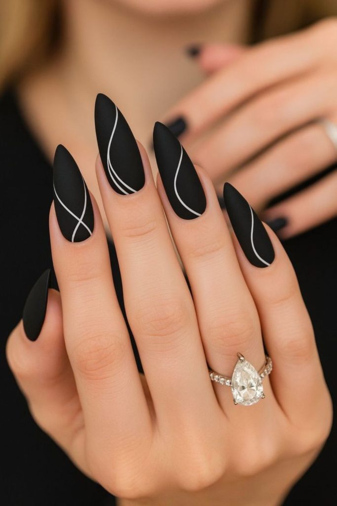 Thin scribbled lines on black nails