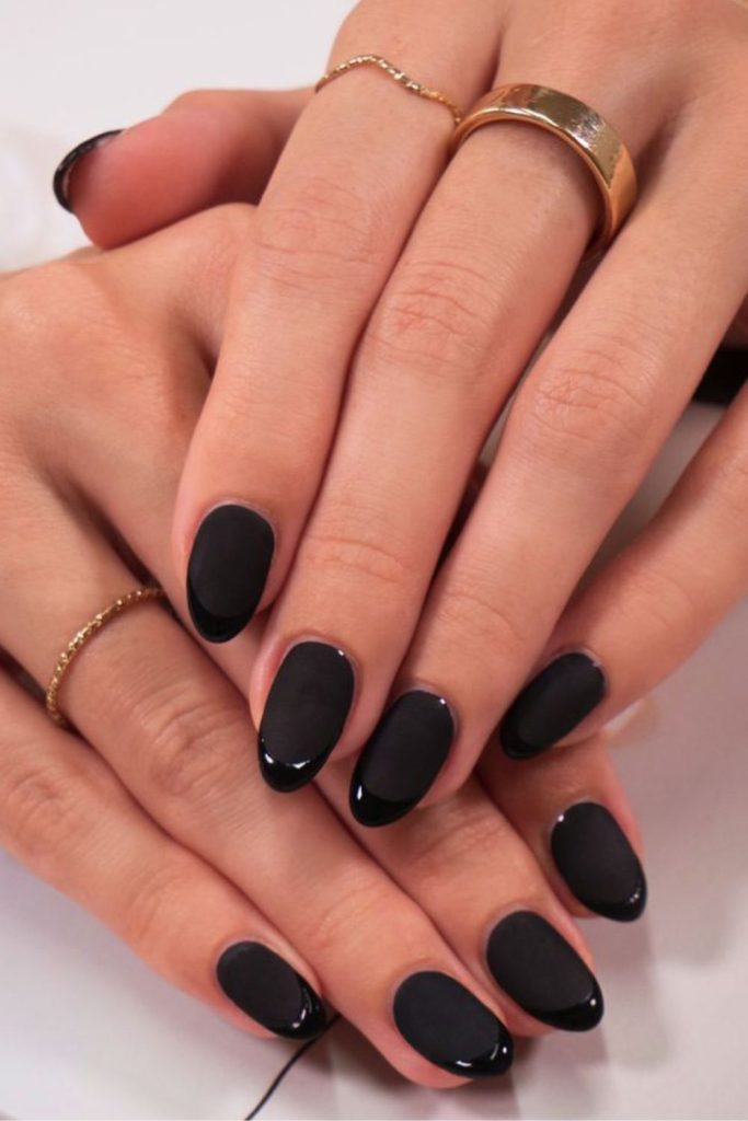 Glossy tips over matte black nails