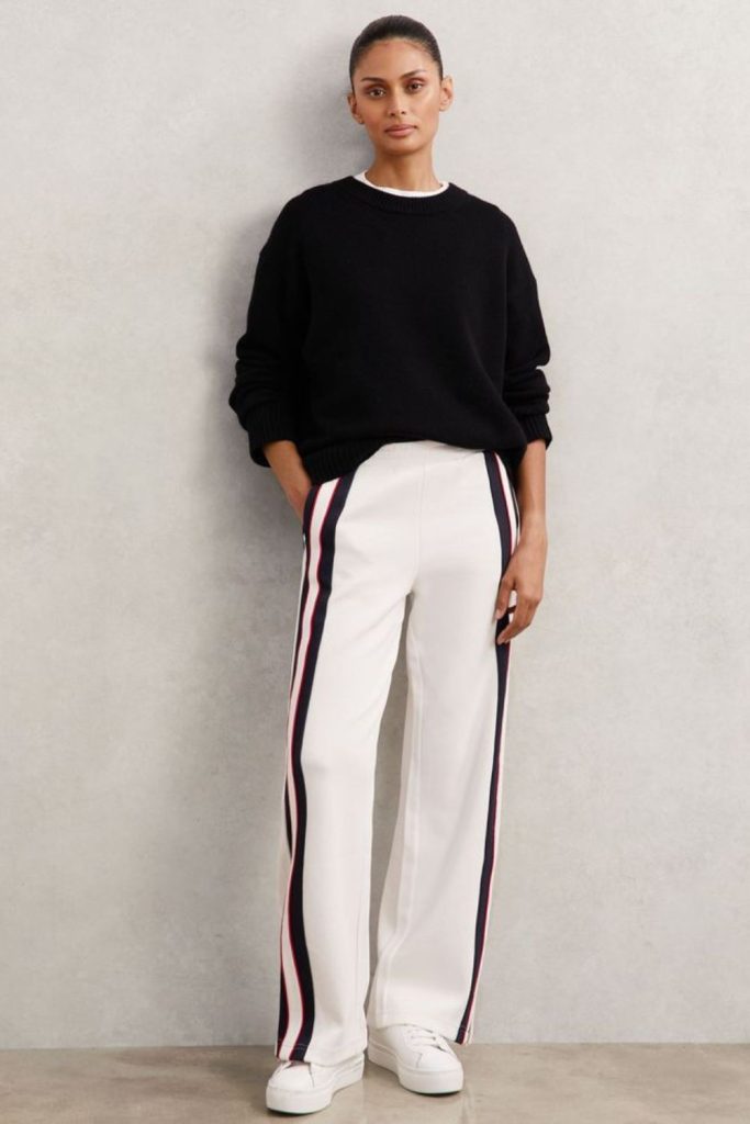 Reflective track pants with minimalist top