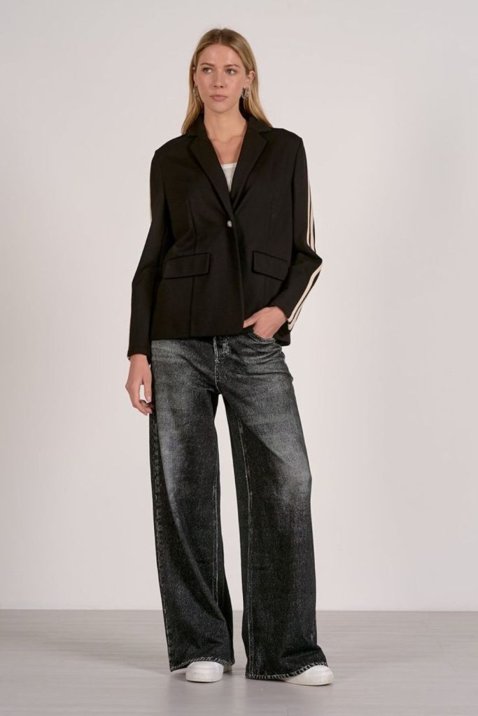 Reflective blazer with structured minimalist trousers
