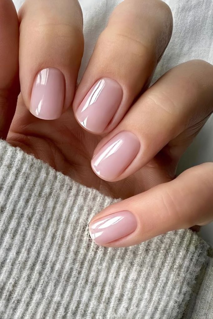 Rose-tinted milky nails natural look.