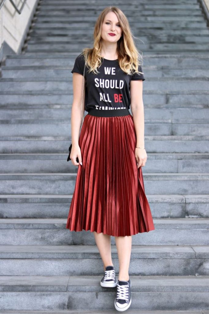 Graphic tee with leather pleated skirt