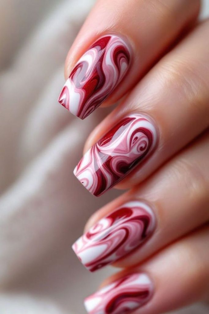 Ruby flame marble nail design.