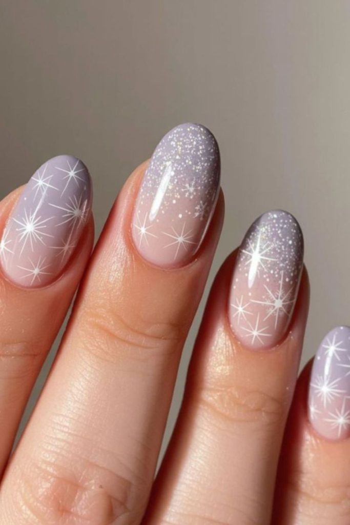 Tiny silver snowflake doodles on nails