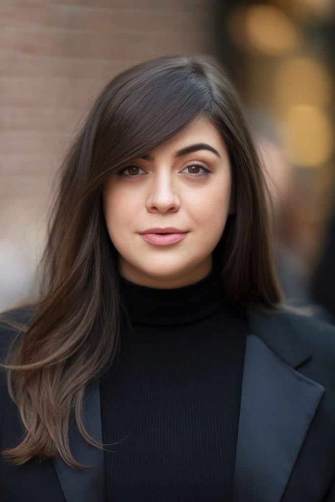 Side-swept bangs framing soft round cheeks