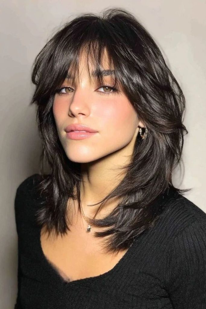 Grey jagged wolf cut tousled.