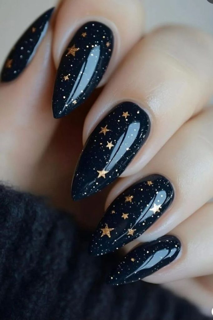 Midnight nails with metallic star flecks.