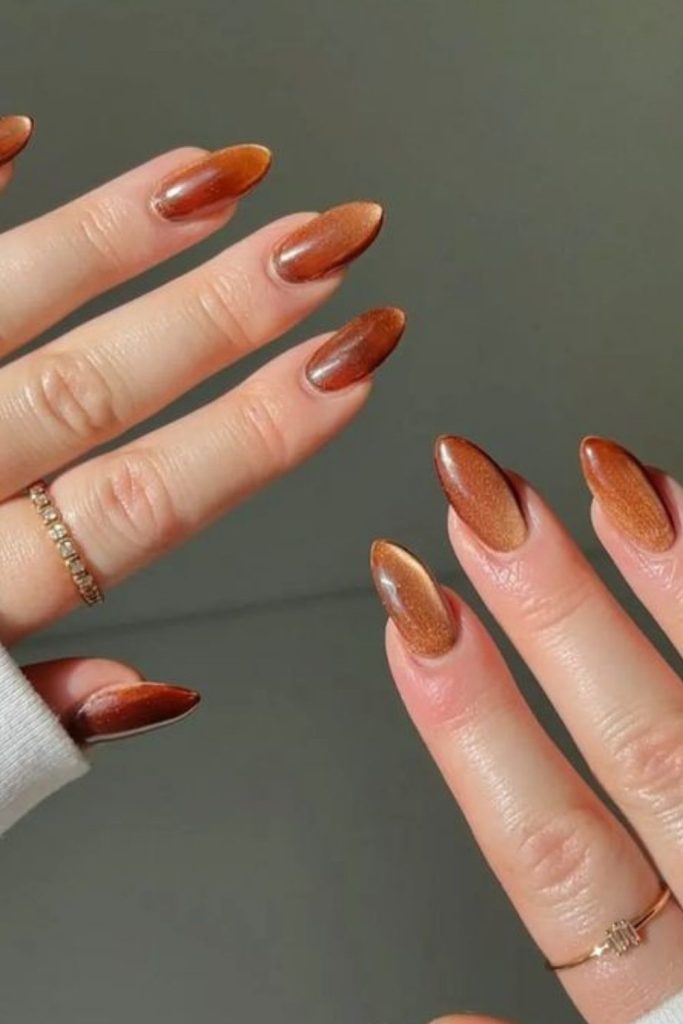 Amber gradient nails with golden flecks