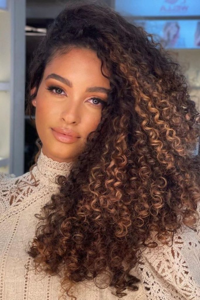 Dense jungle curls with deep shadow layers.