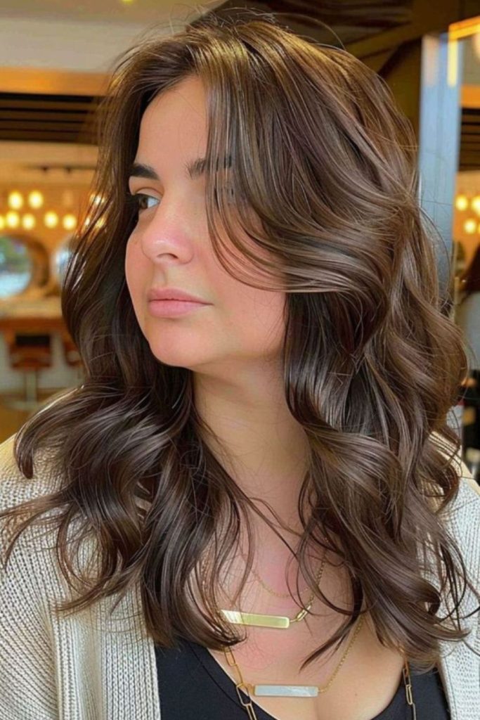 Tousled mid-length layered wavy haircut