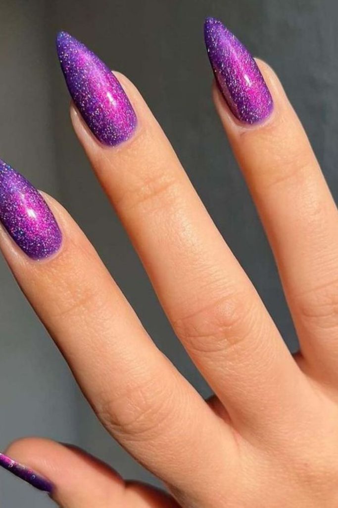 Purple holographic nails with reflective angles