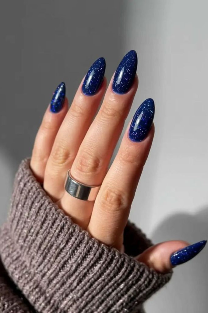 Deep matte blue nails with shimmer