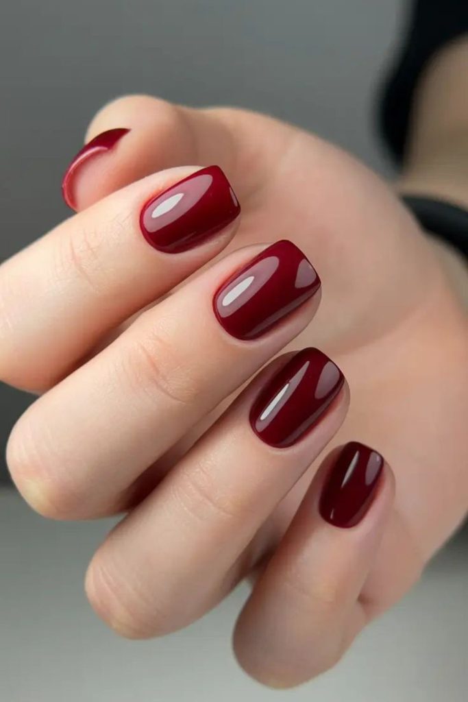Deep wine satin finish nails.