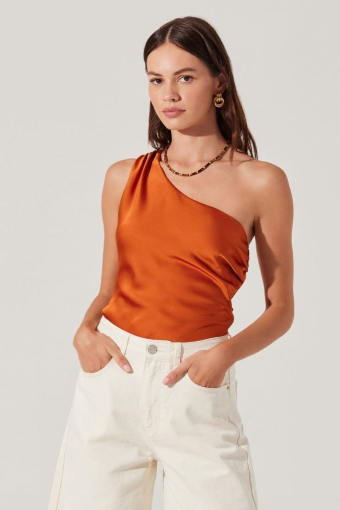 Burnt orange satin tank beige trousers
