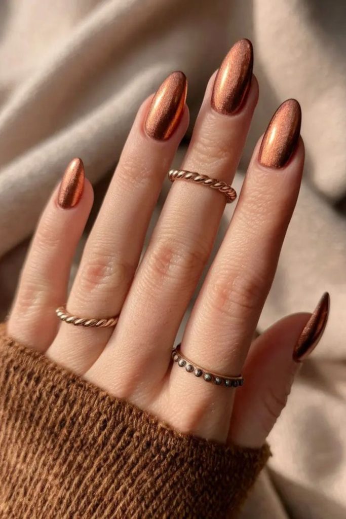 Amber nails with subtle gold accents