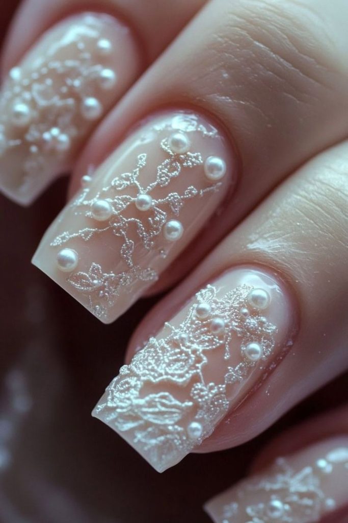 Cream nails with delicate lace patterns