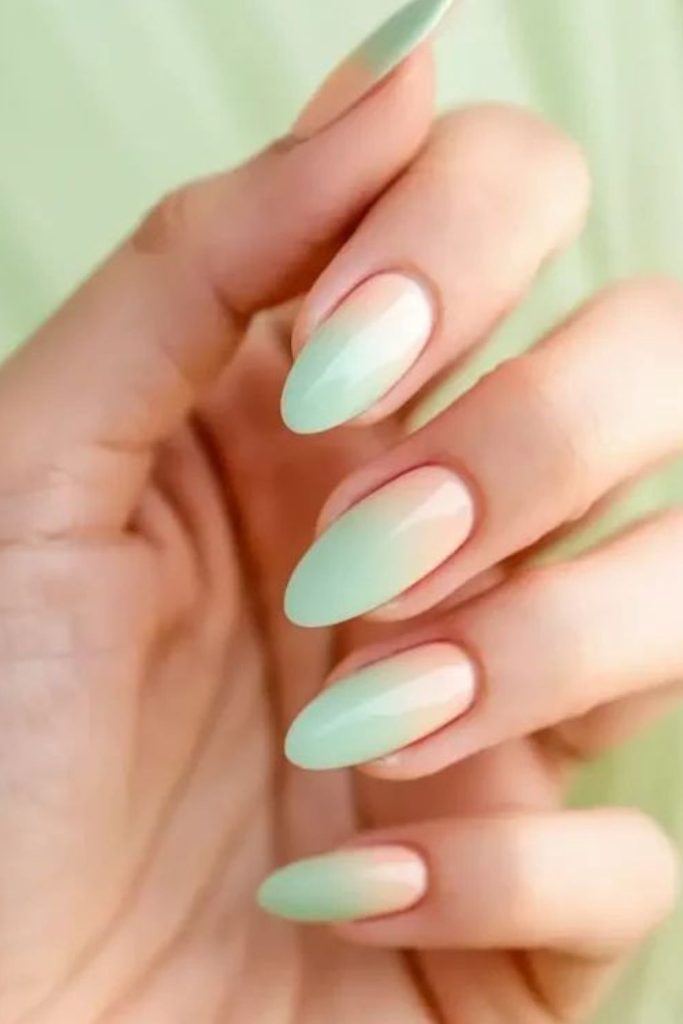 Pale aqua nails with sandy hues