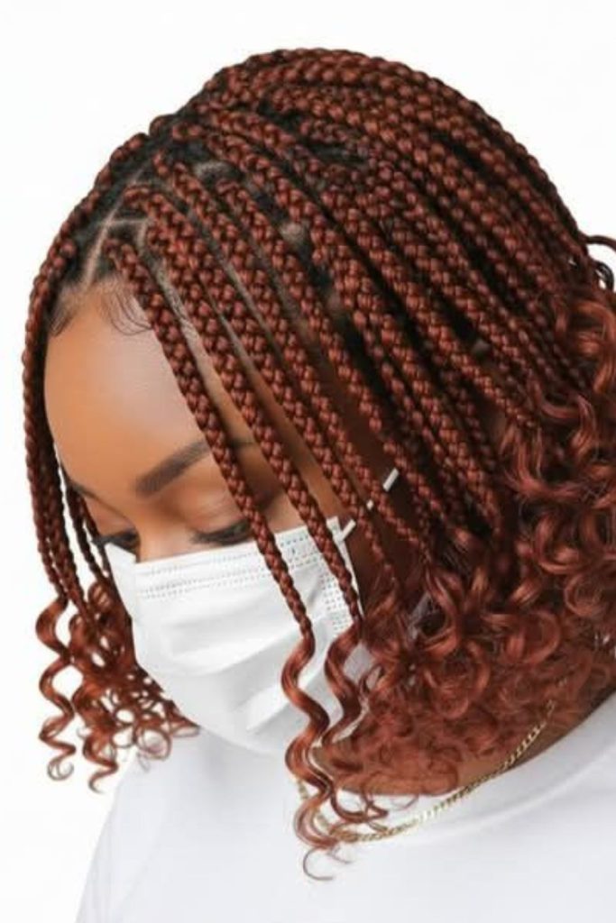 Red-orange braids with scattered beads