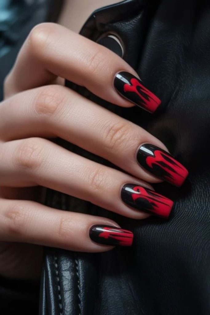 Obsidian nails with tiny wing motifs