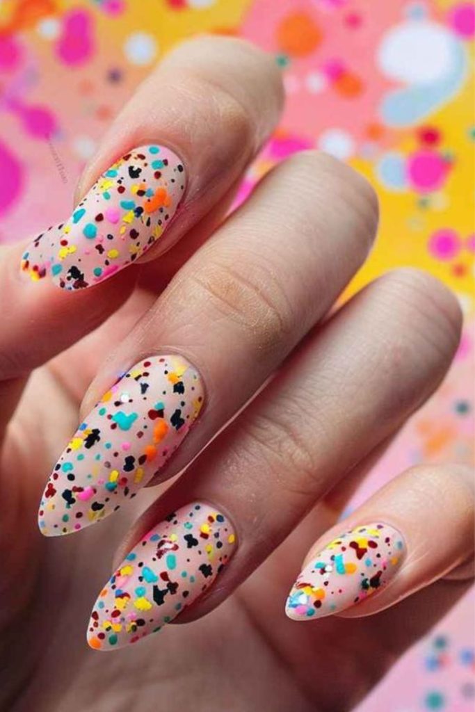 Neon confetti nails with playful chaos.