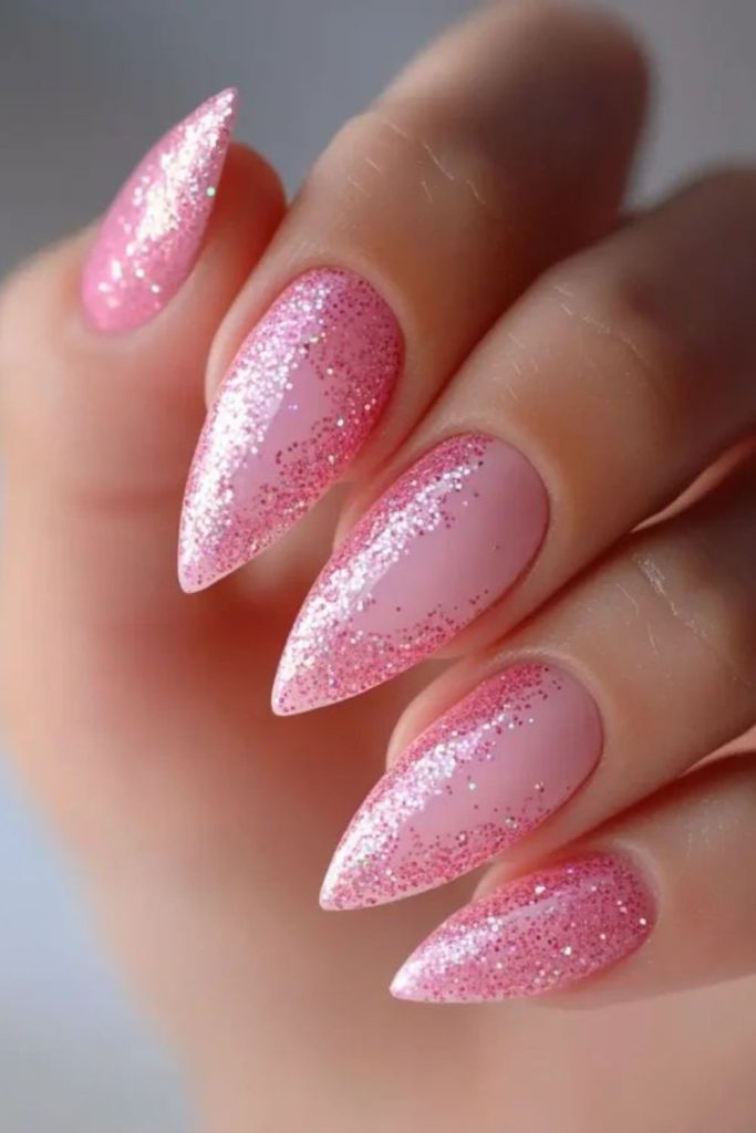 Bubblegum pink nails with random glitter.
