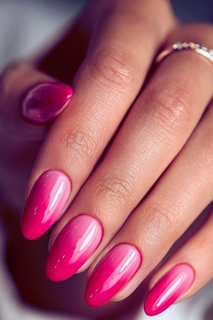 Bubblegum pink drip nails with glitter.