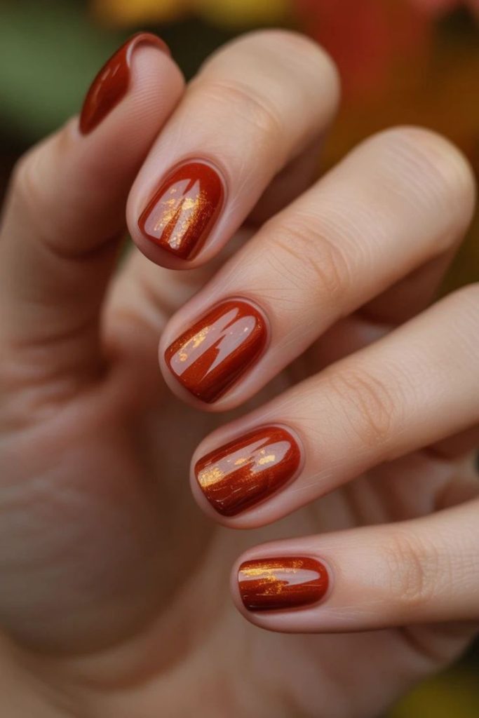 Burnt orange nails with copper highlights