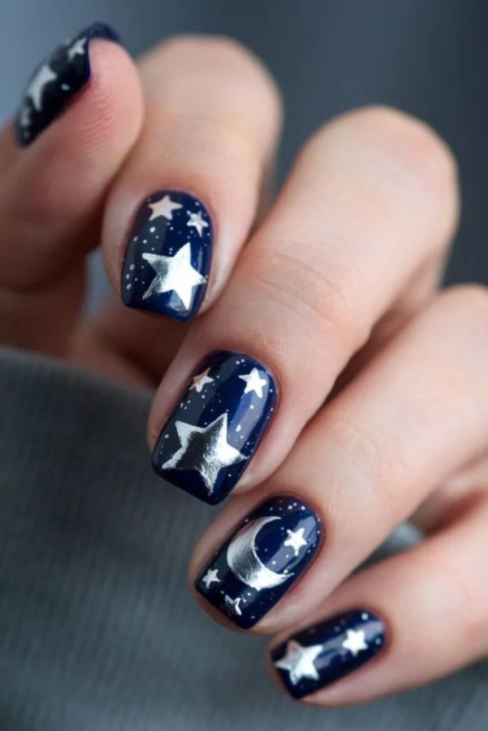 Sapphire nails with metallic star-like details