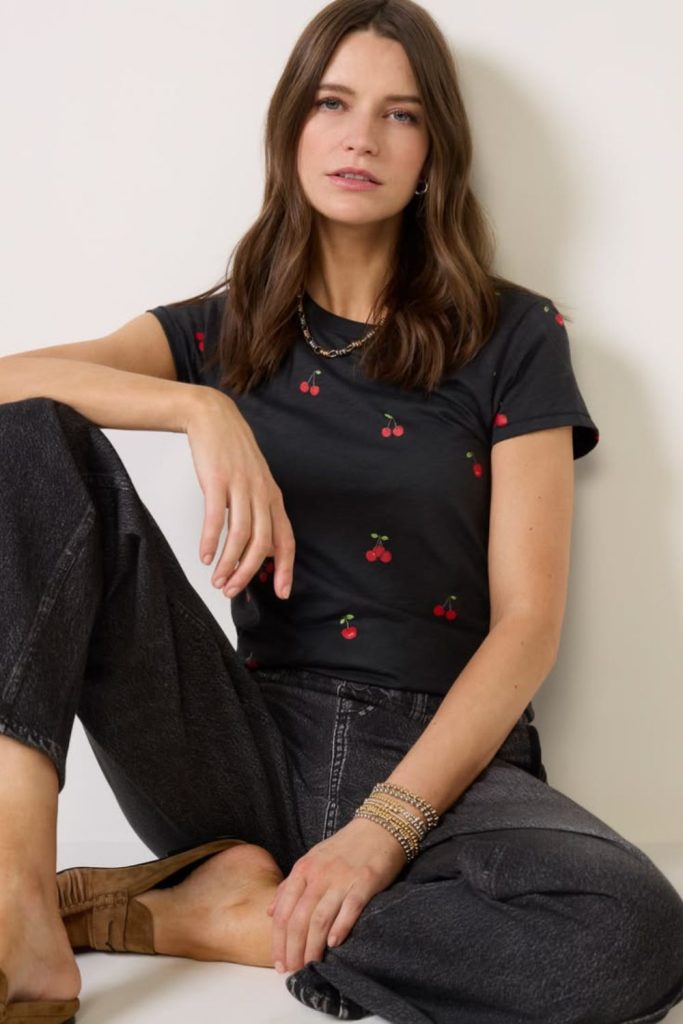 Cherry print top jeans playful style.