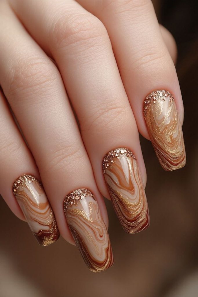 Caramel swirl nails with cinnamon tones