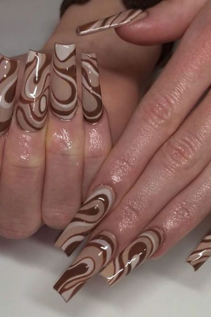 Beige chocolate nails with coconut swirl