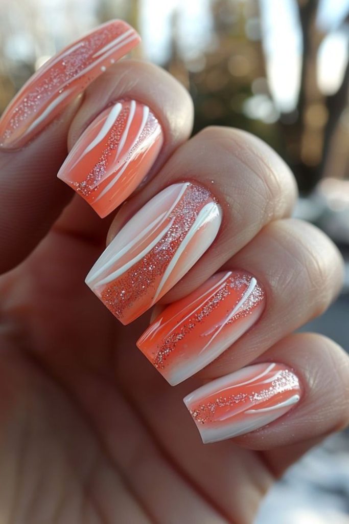 Coral streaks over nude glossy nails