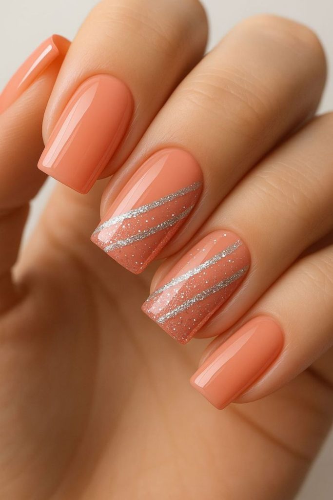 Coral glossy spring manicure.