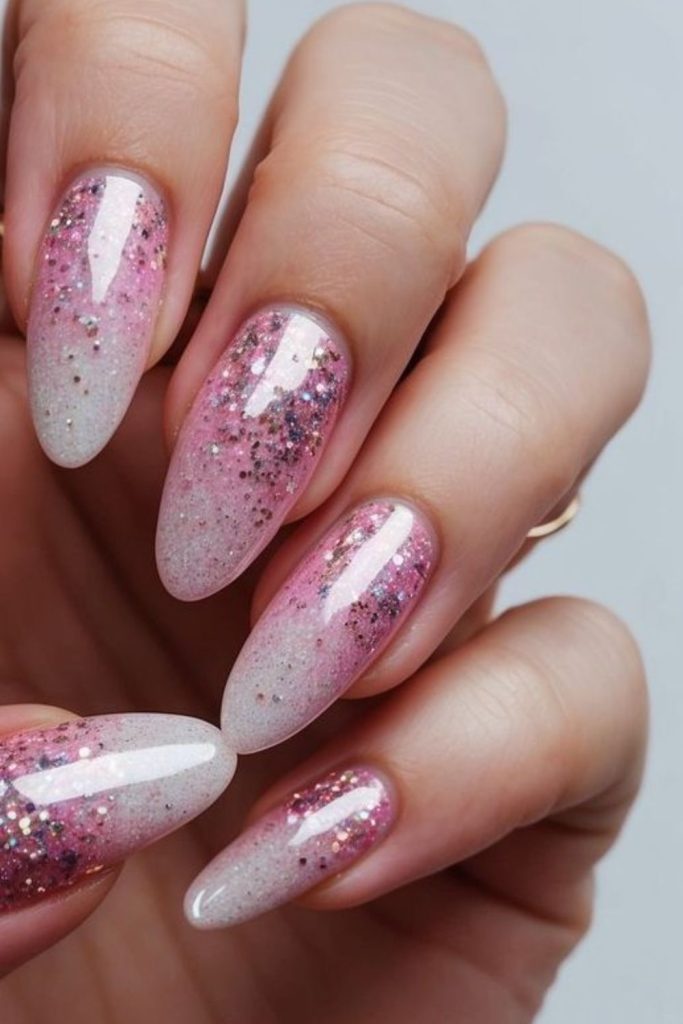Pastel pink nails with dreamy sparkle.