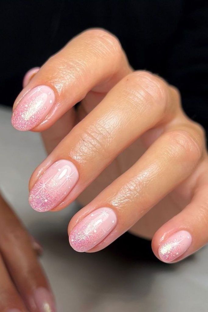Pastel pink nails with delicate shimmer.