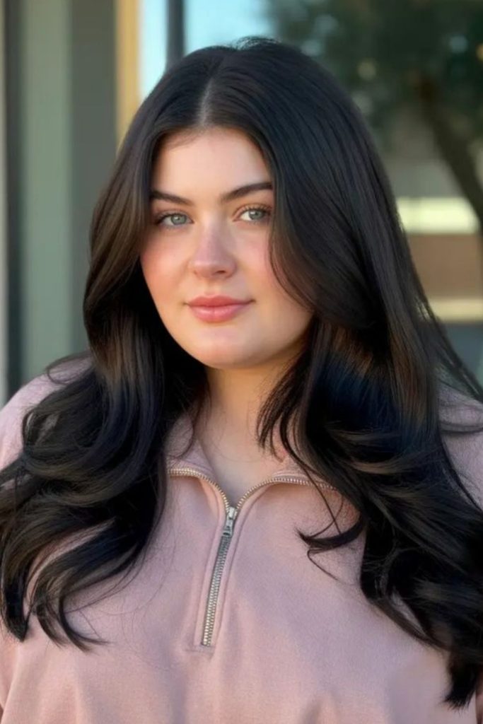 Long sleek center parted dark hair